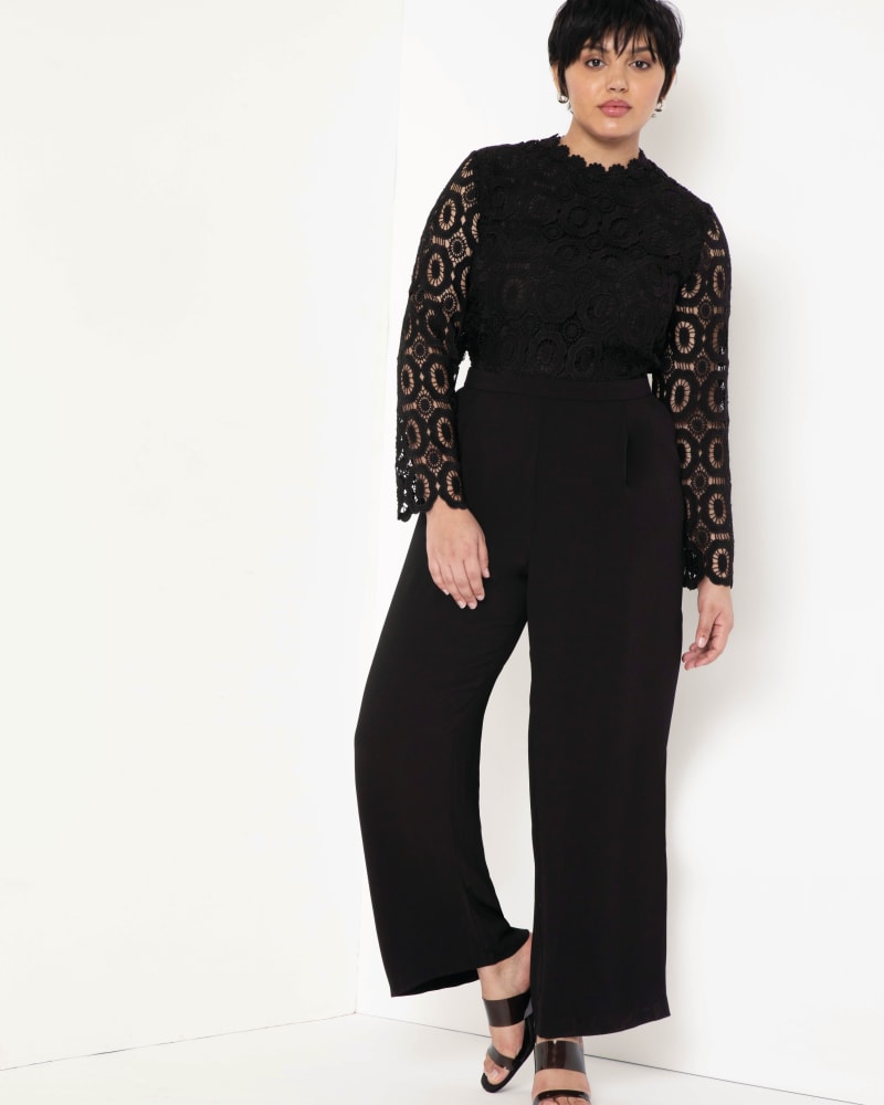 Front of a model wearing a size 14 Lauren Lace Jumpsuit in Black by ELOQUII. | dia_product_style_image_id:204323